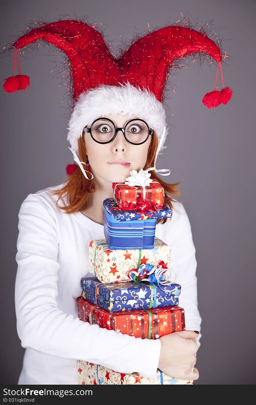 Surprised Red-haired Girl In Christmas Cap