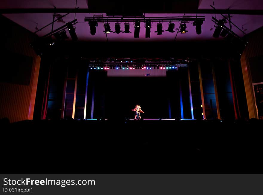 Shot of performers on stage with lights in the background. Shot of performers on stage with lights in the background