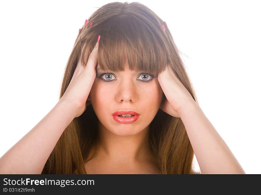 Girl in a black dress stay before a white background and looks into the camera