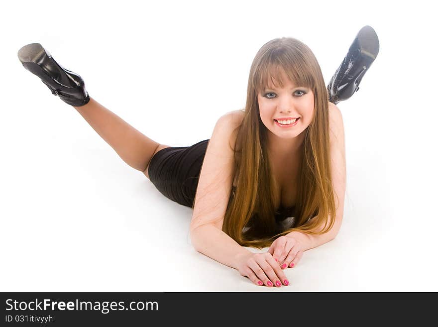 Girl in a black dress lay on the white background