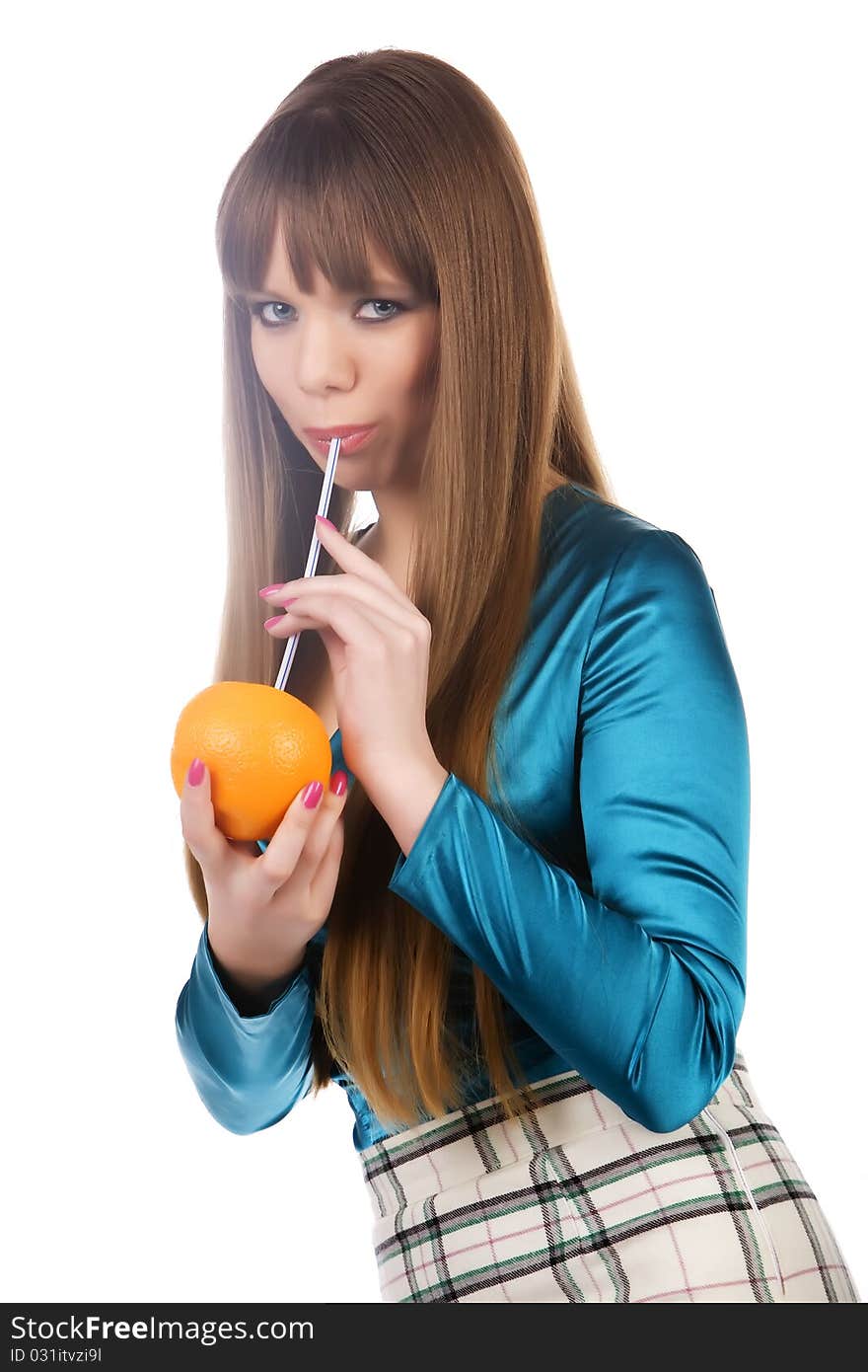 The girl with an orange, a tubule for drink on a white background