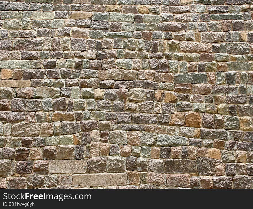 Detail of an old  stone wall made out of huge blocks of stone