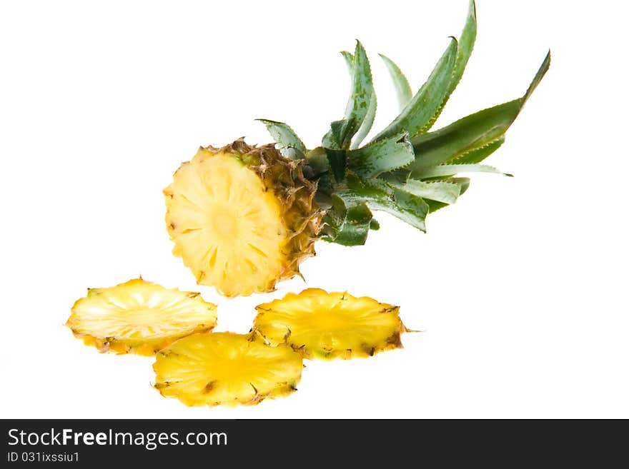 Cut pineapple isolated on white background