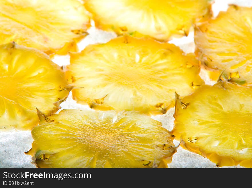 Cut pineapple isolated on white background