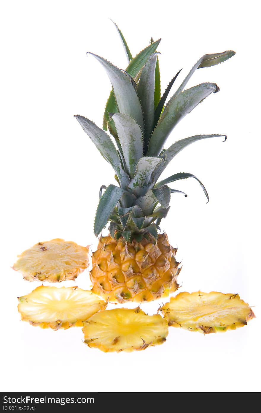 Cut pineapple isolated on white background