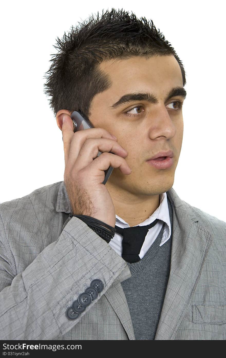 Man in office working and talking on his cell