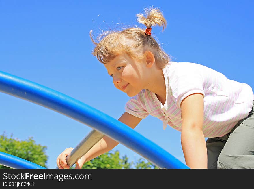 The girl passes through the ladder. The girl passes through the ladder.