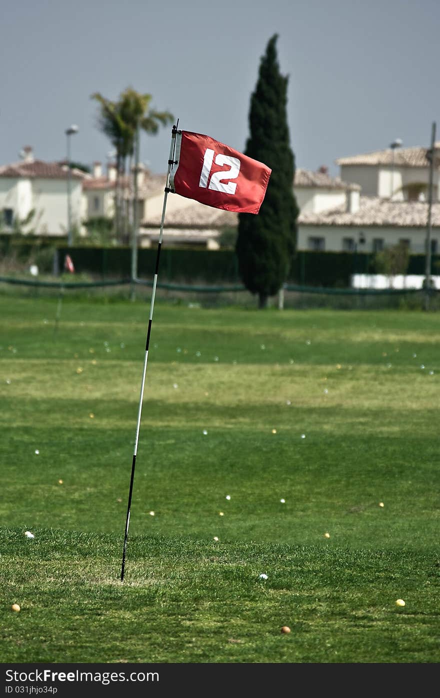 Red flag on driving range of golf course in Spain. Red flag on driving range of golf course in Spain.