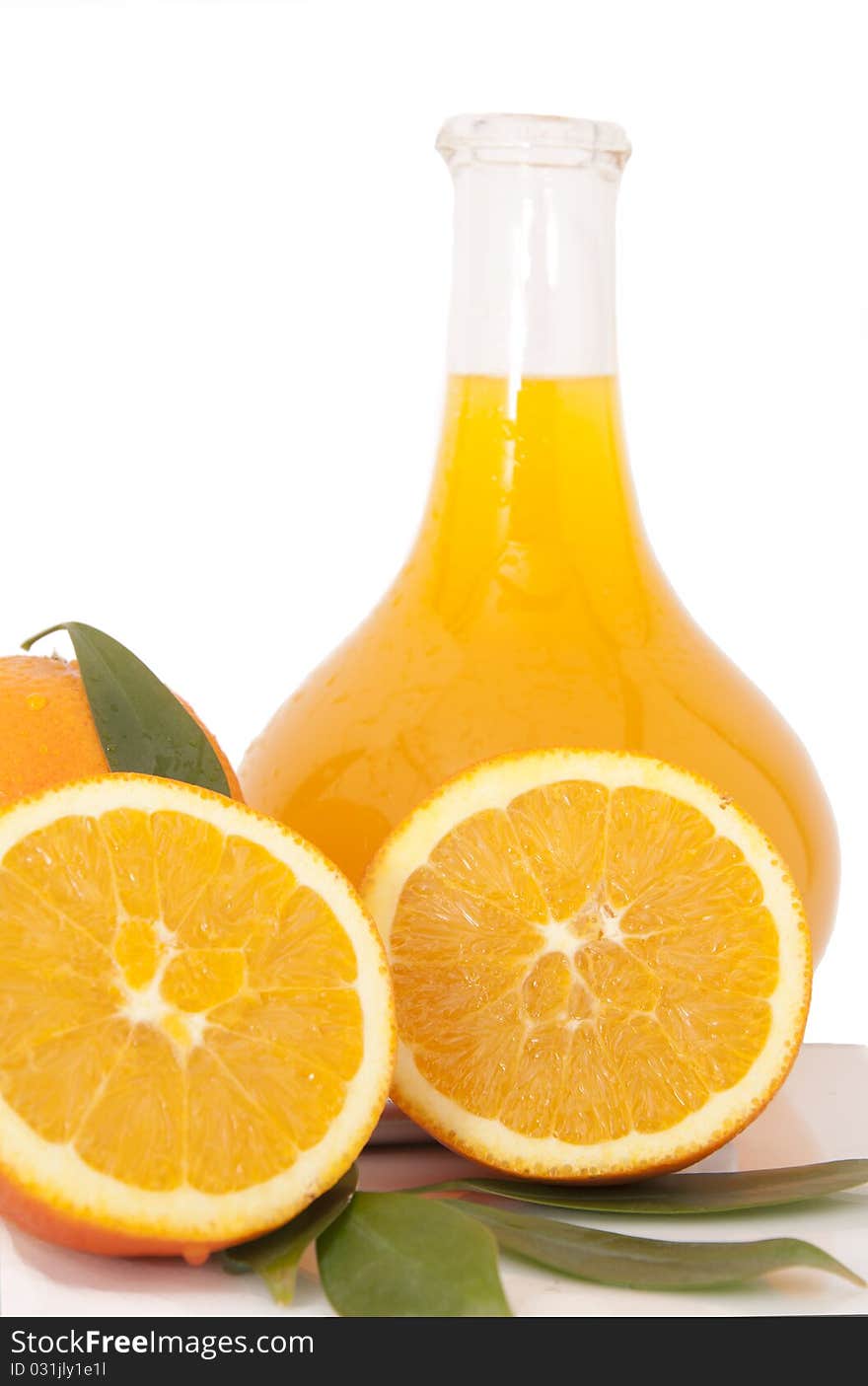 Orange juice and freshly squeezed orange