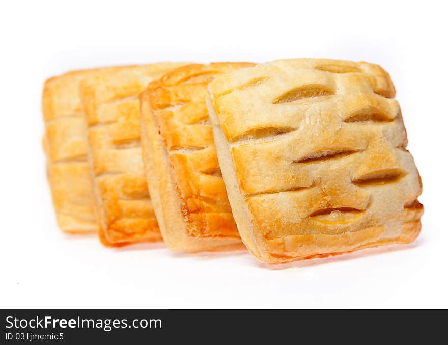 Four pies with cherry jam isolated on white background