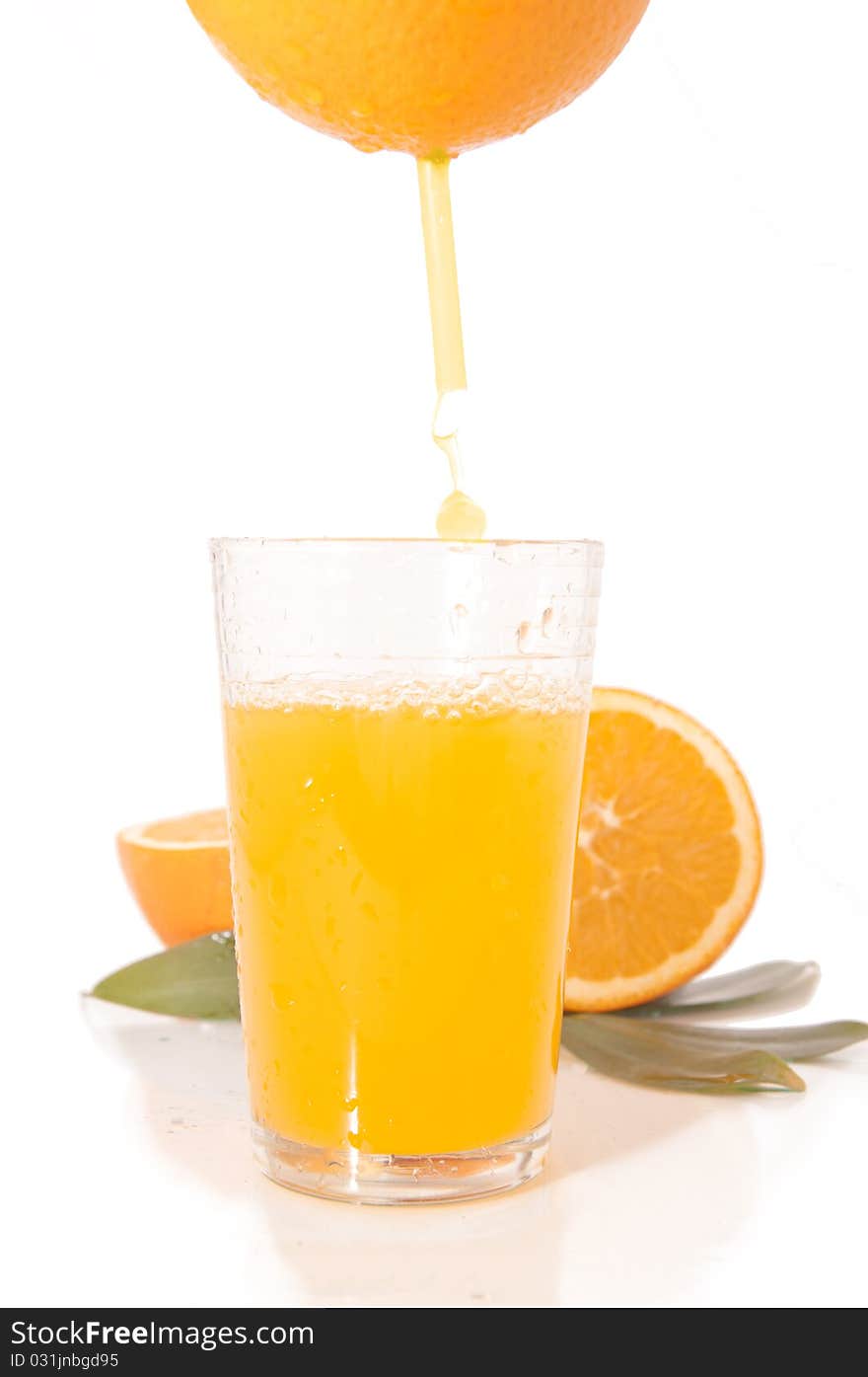 Orange juice and freshly squeezed orange