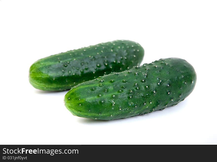 Healthy food. The green cucumbers isolated on whit