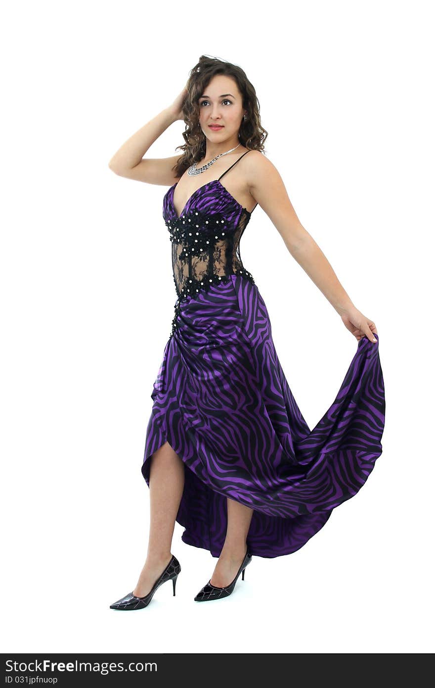 Attractive young woman in elegant purple dress