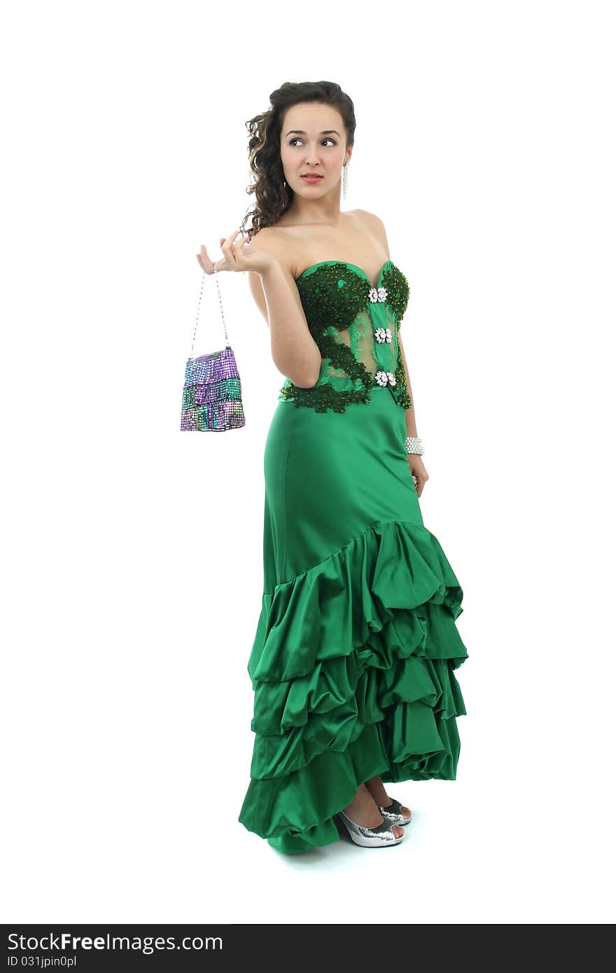 Attractive young woman in elegant green dress