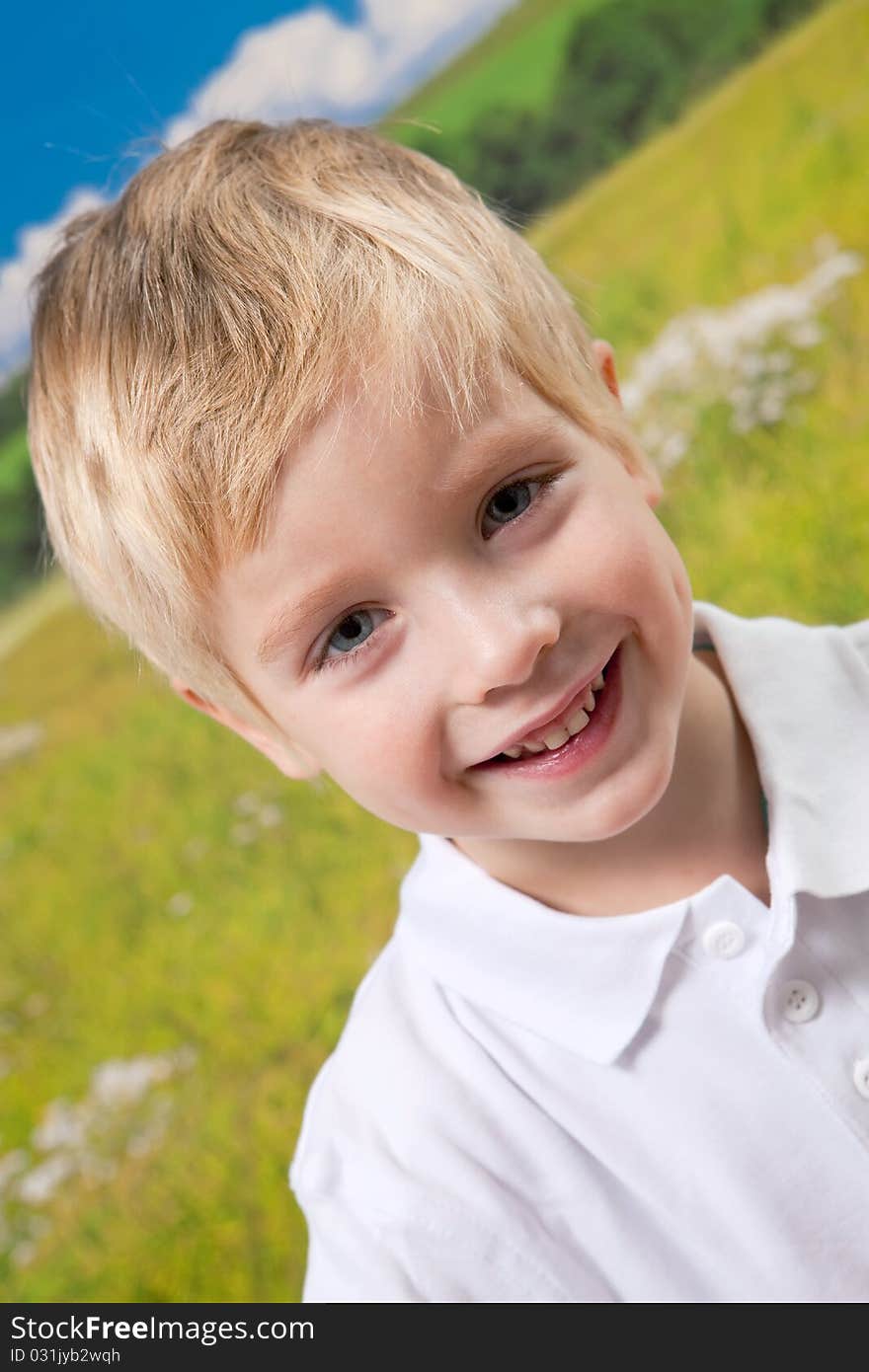 Smiling Boy On Natural Background