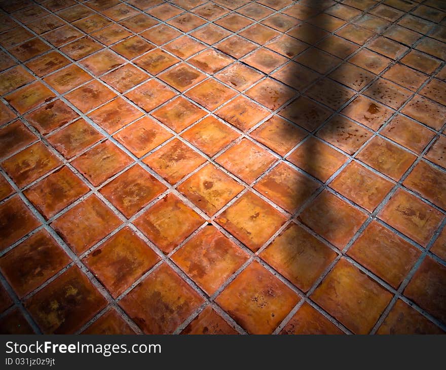 Top Perspective of Square red tiles floor with shadow