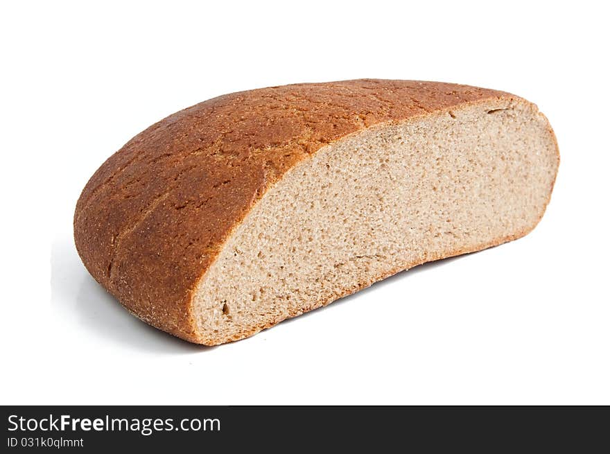 Half of black bread on a white background