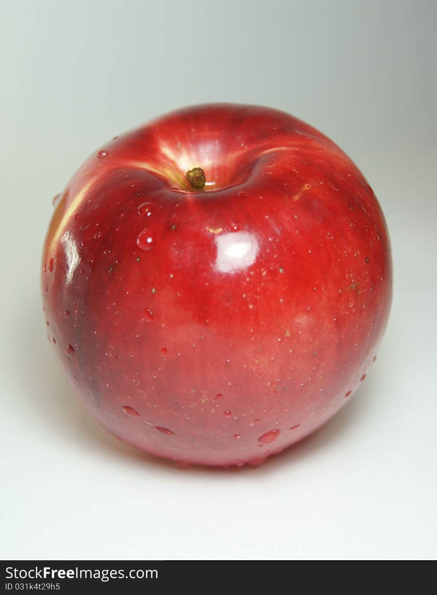 Ripe red apples on a dark background