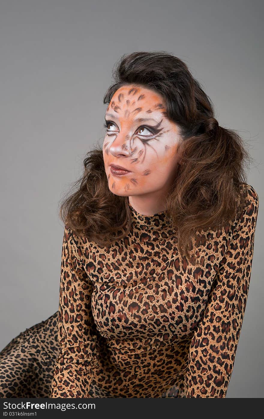 Portrait of girl with leopard s face-art