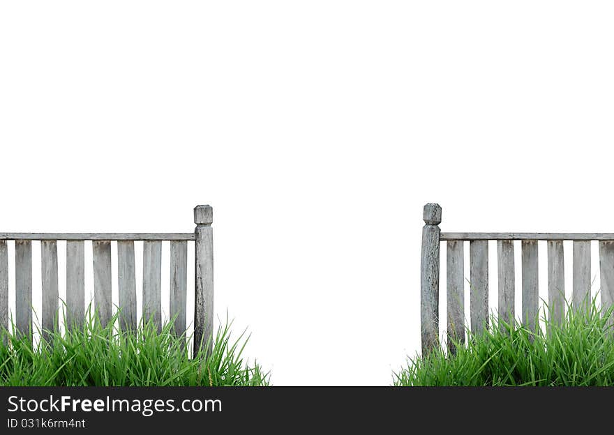 Old wooden fence with grass isolated