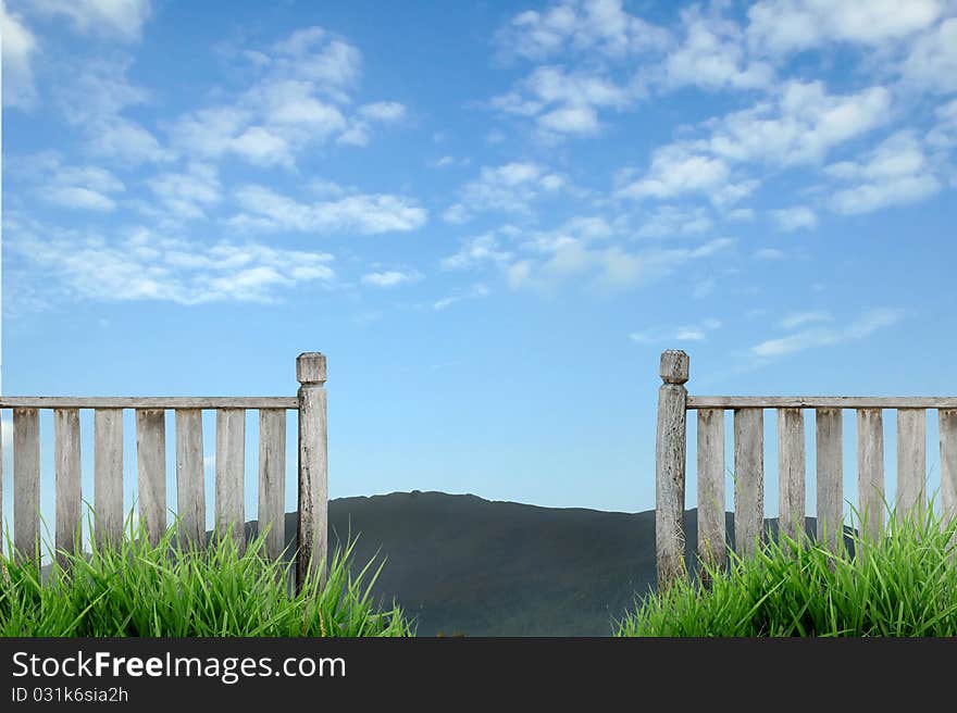 Old wooden fence with blue sky. Old wooden fence with blue sky