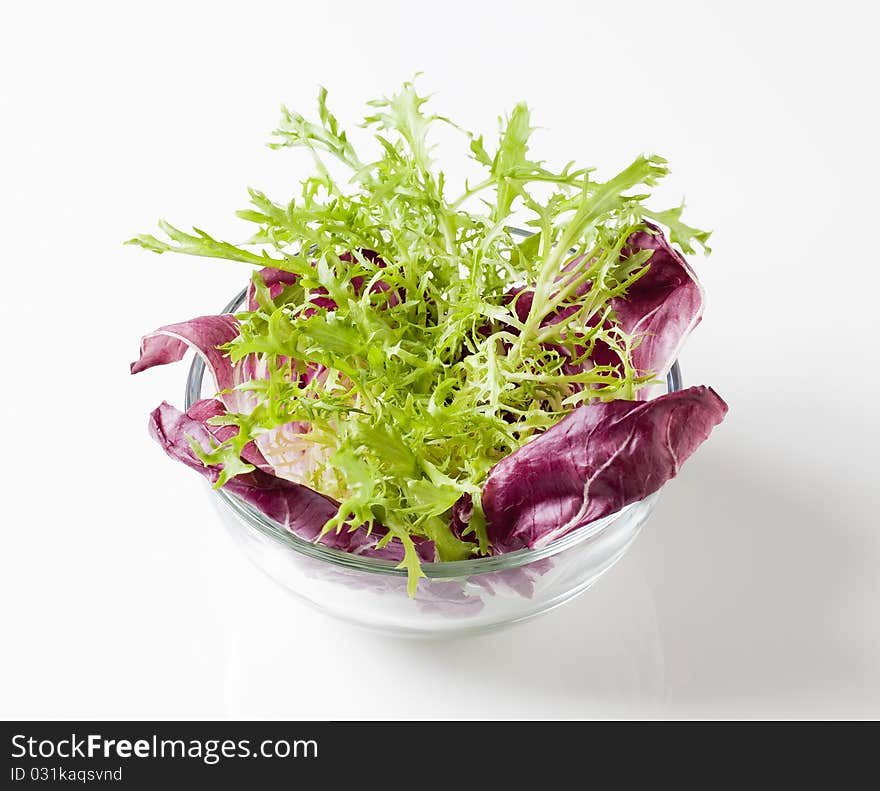 Bowl of fresh salad greens - studio