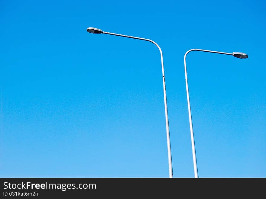 Electricity lamp post on the blue sky