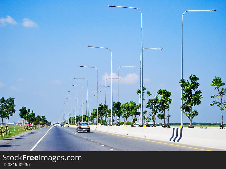 Urban roady way with electricity lamp post on the sideway. Urban roady way with electricity lamp post on the sideway