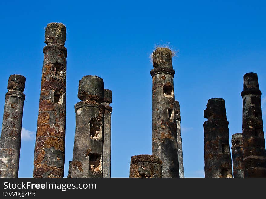 Ancient stone pillar with blue sky in the historic national park in Thailand. Ancient stone pillar with blue sky in the historic national park in Thailand