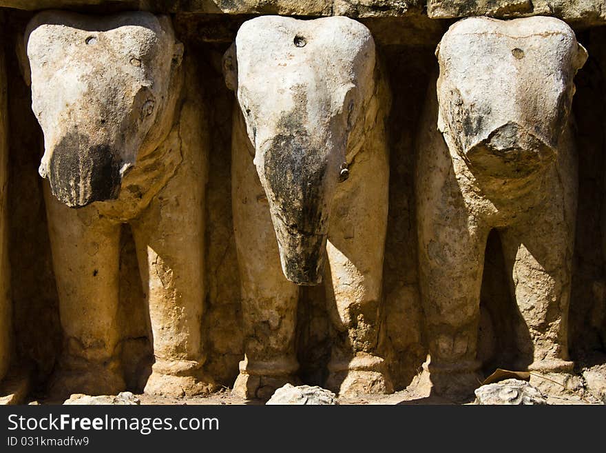 Ancient and broken sculpture of three elephant in the wall in the Historic Park of Thailand. Ancient and broken sculpture of three elephant in the wall in the Historic Park of Thailand
