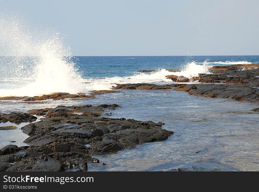 The Pacific Ocean Slamming Against A Tidal Pool