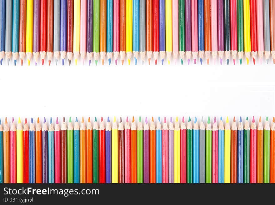 A lot of colored pencils on white background. A lot of colored pencils on white background