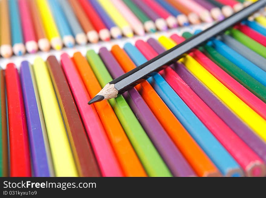 A lot of colored pencils on white background. A lot of colored pencils on white background