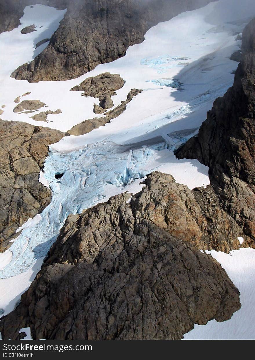 The Queest-alb Glacier in the Cascade Mountains of Washington state. It features old blue ice with many fissures and crevasses. The Queest-alb Glacier in the Cascade Mountains of Washington state. It features old blue ice with many fissures and crevasses.