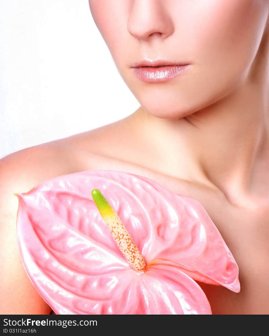 Young woman with pink flower. Young woman with pink flower