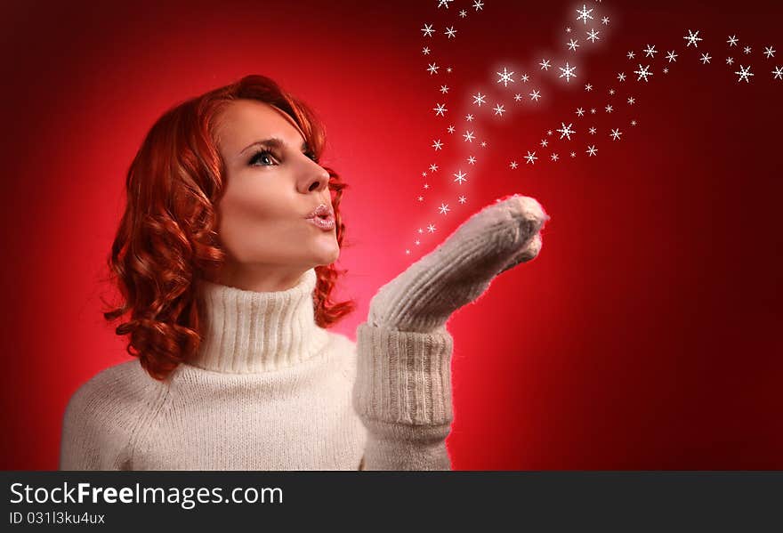 Pretty young woman with snow flakes on red background. Pretty young woman with snow flakes on red background