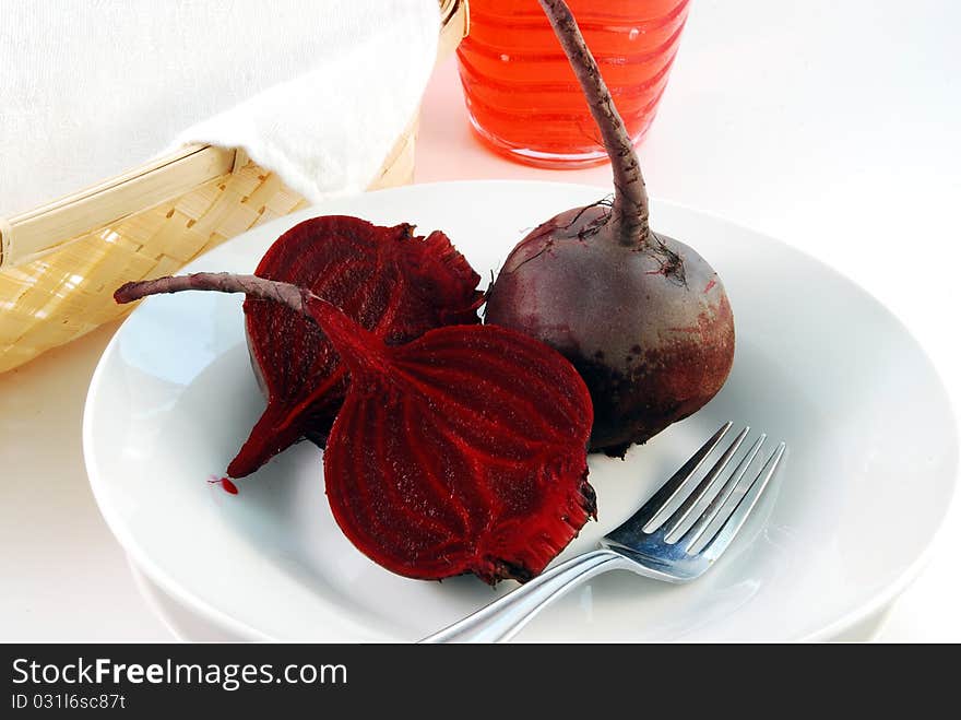 Juicy red beet on a white plate. Juicy red beet on a white plate