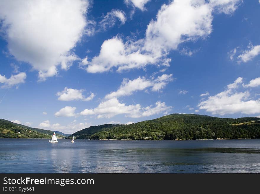 Beautiful lake located between the mountains on which you can sail.