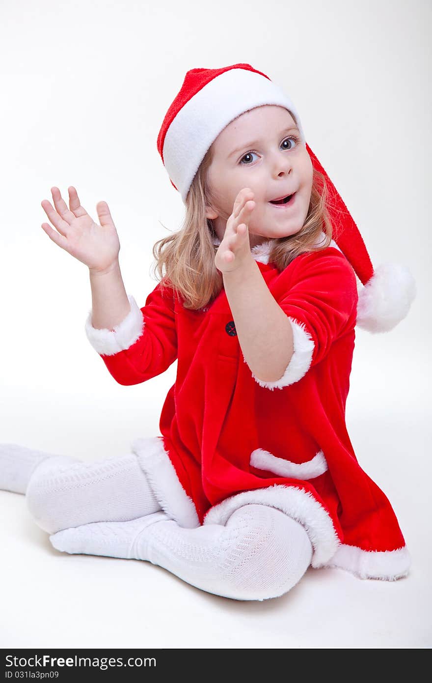 Joyful santa girl on white background