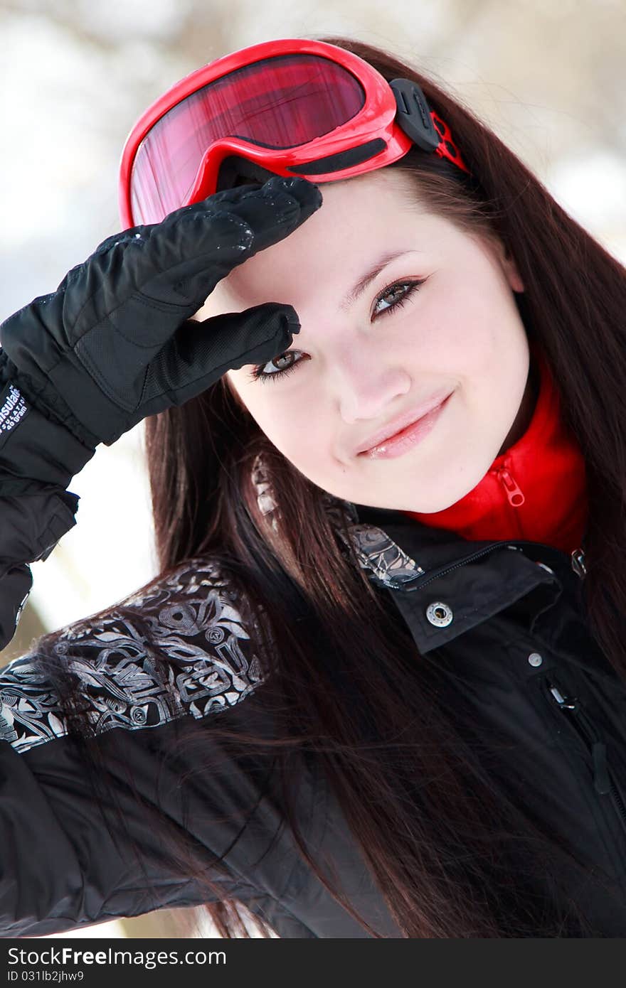 Winter portrait of lovely brunette girl outdoors