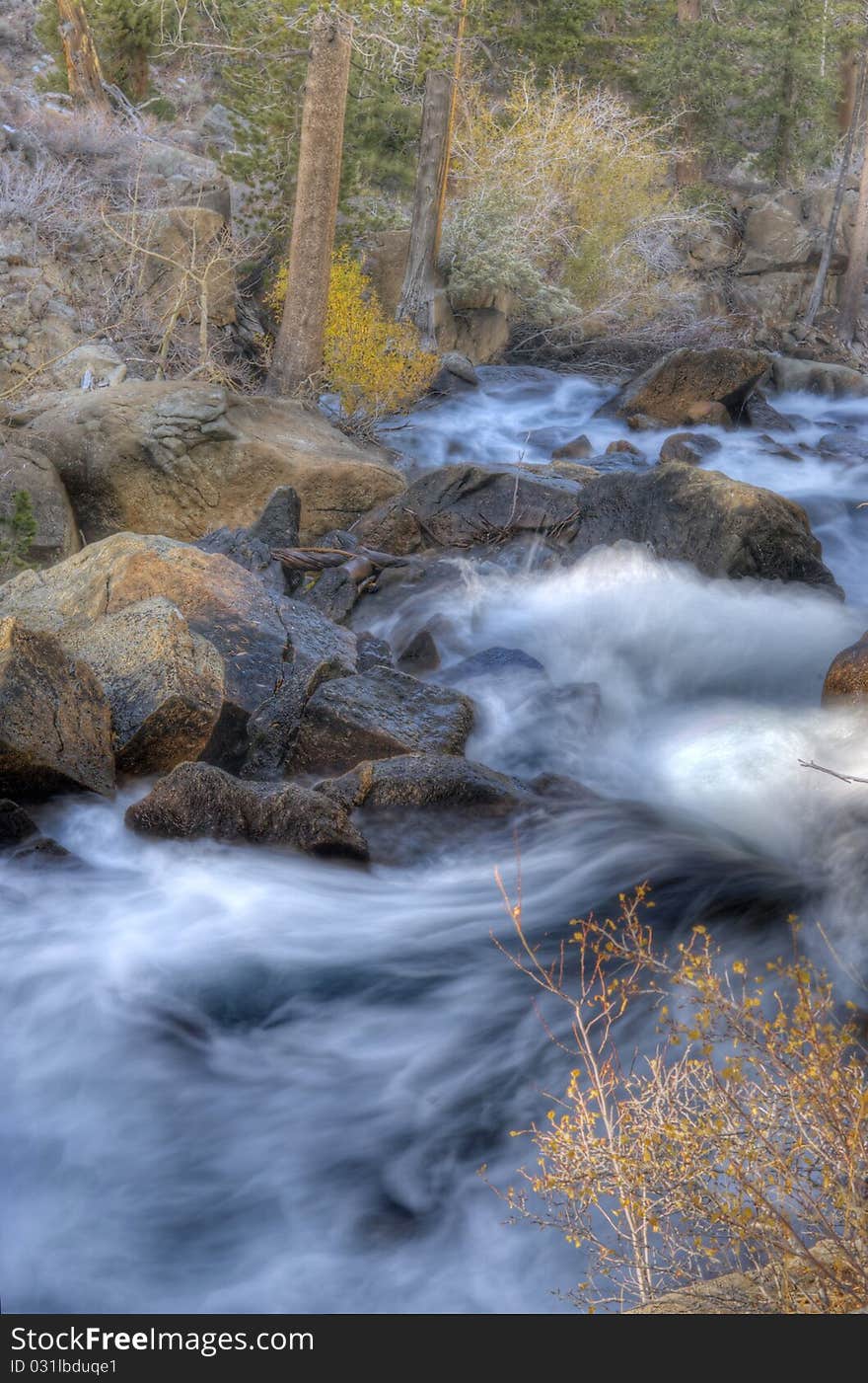 Artistic creamy river rapids with rocks. Artistic creamy river rapids with rocks