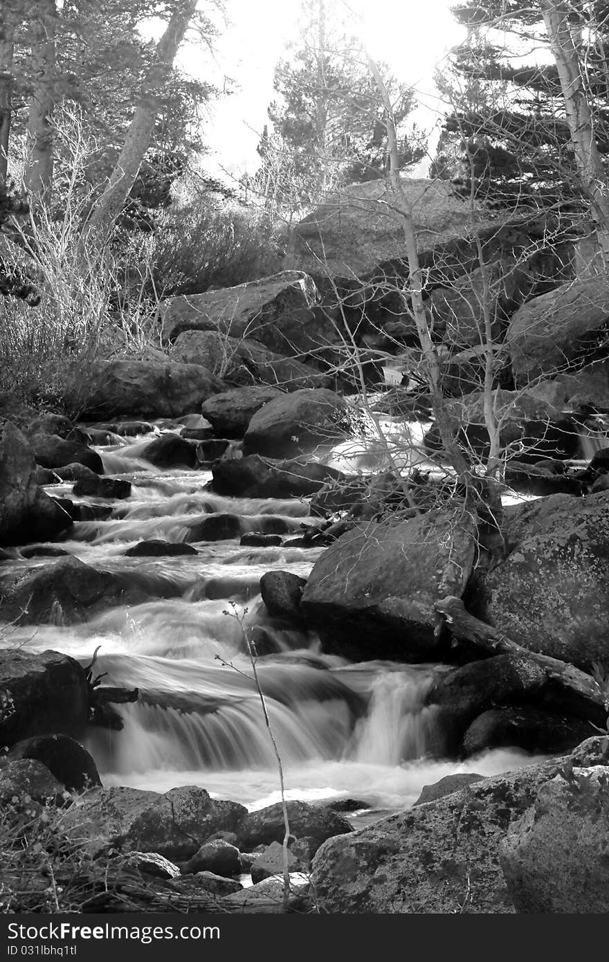 Artistic creamy river rapids with rocks. Artistic creamy river rapids with rocks