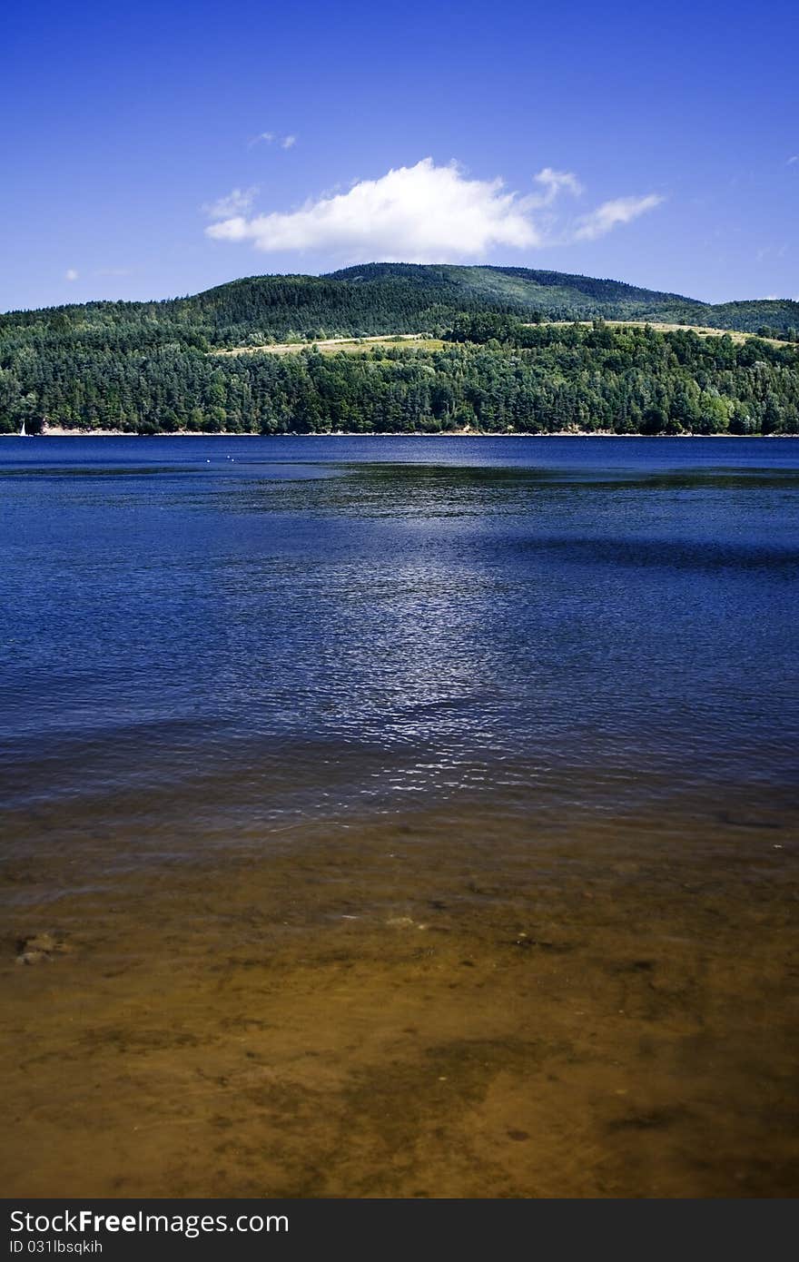 Beautiful lake located between the mountains on which you can sail.