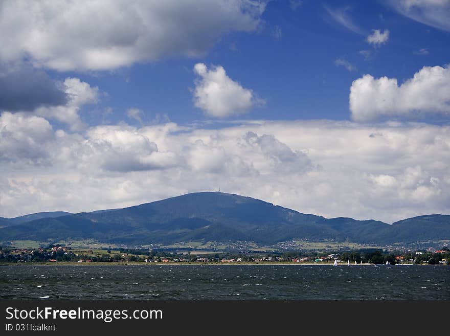 Beautiful lake located between the mountains on which you can sail. Beautiful lake located between the mountains on which you can sail.