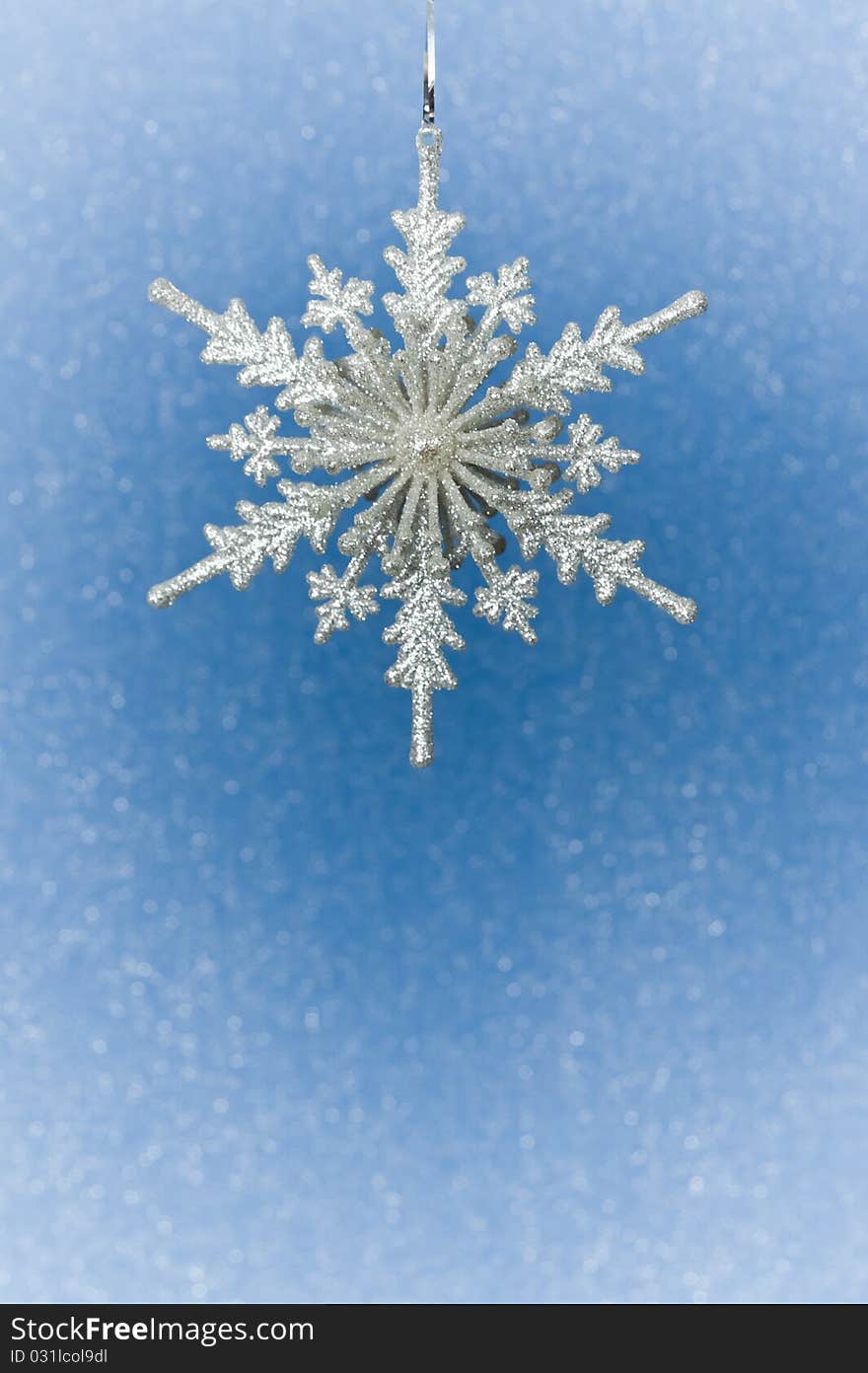 Silver Christmas snowflake  on blue background