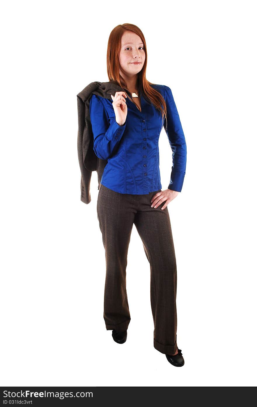 A business woman in a brown suit standing in profile with her jacket over her shoulder and a blue blouse for white background. A business woman in a brown suit standing in profile with her jacket over her shoulder and a blue blouse for white background.