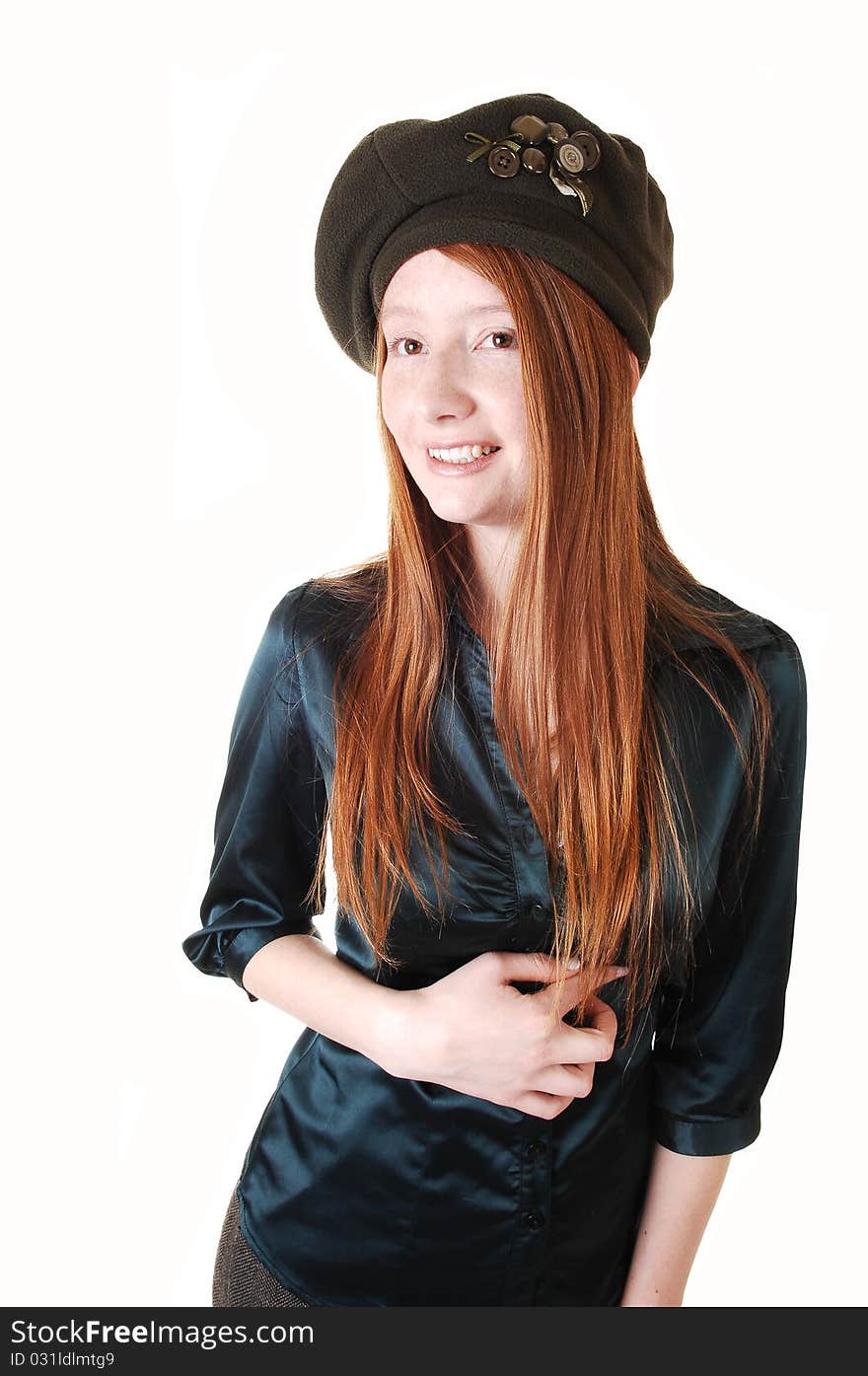 A young pretty woman with long red hair in a green blouse wearing
a hat with buttons on, for white background. A young pretty woman with long red hair in a green blouse wearing
a hat with buttons on, for white background.