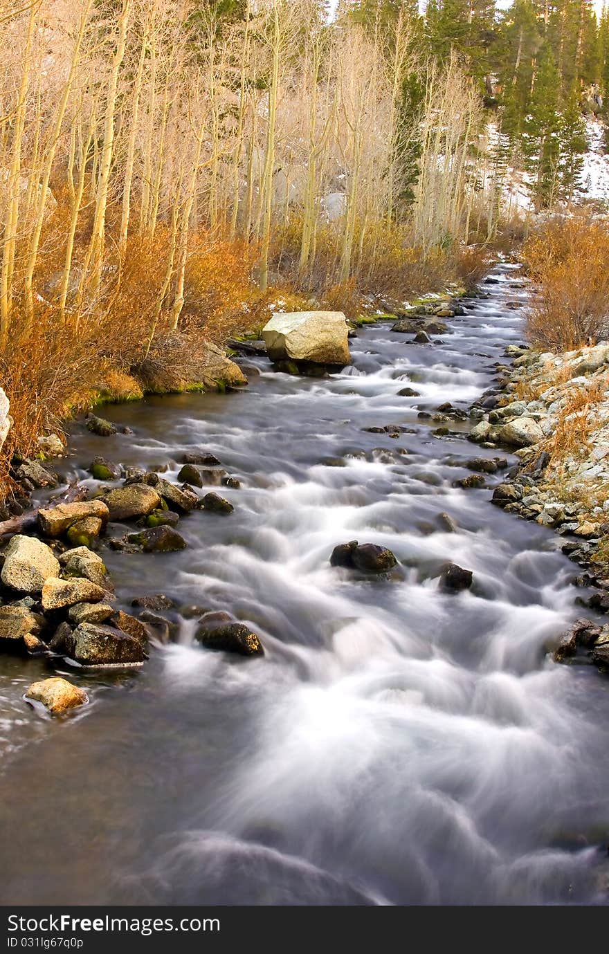 Artistic creamy river rapids with rocks. Artistic creamy river rapids with rocks