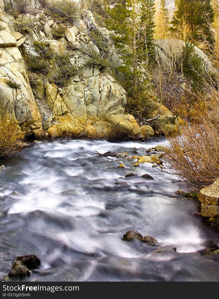 Artistic creamy river rapids with rocks. Artistic creamy river rapids with rocks