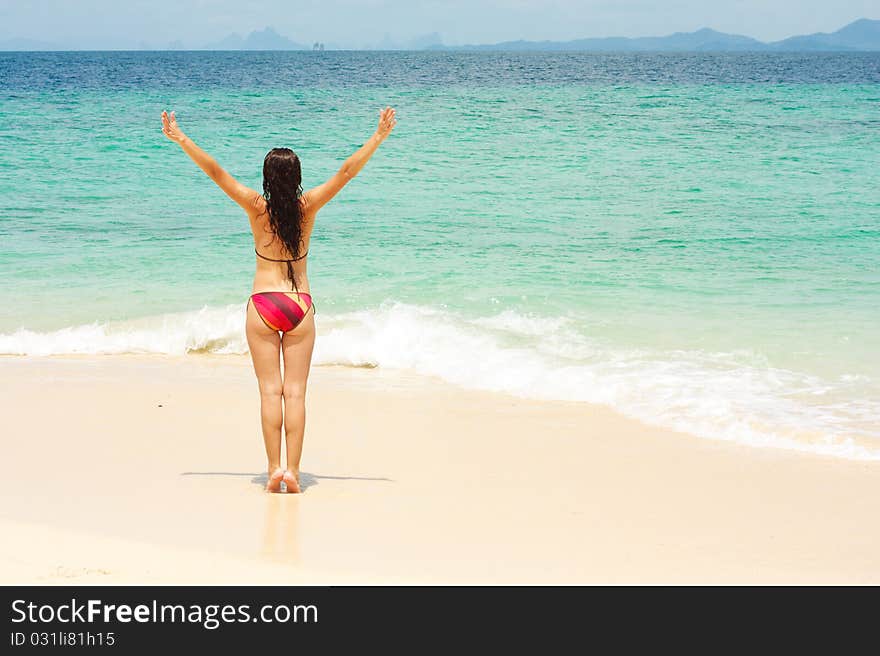 Young lady enjoying sunshine on beach. Young lady enjoying sunshine on beach